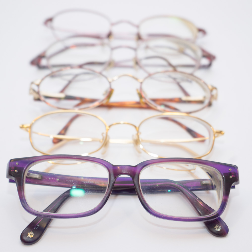 A range of glasses worn in the past by Gill